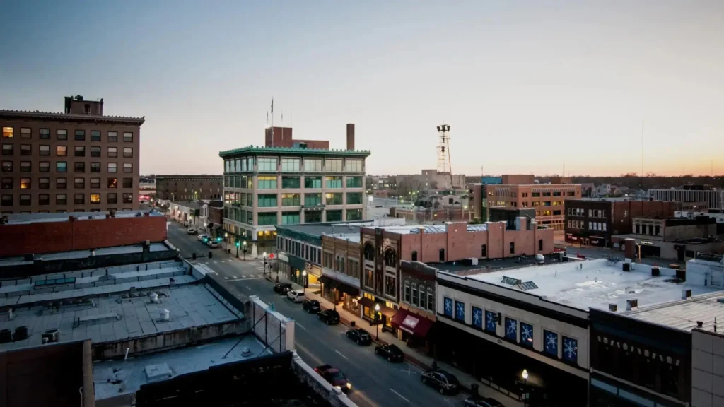 Downtown cityscape at dusk with historic buildings.