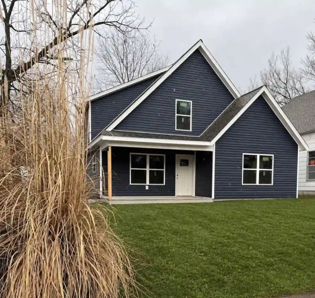 Blue two-story house with white trim